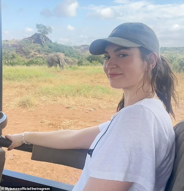 In one snap, she sat in a Jeep as she watched some nearby elephants, looking the part, dressed in cream-coloured trousers and a grey vest, her brown hair half-hidden by a cap.