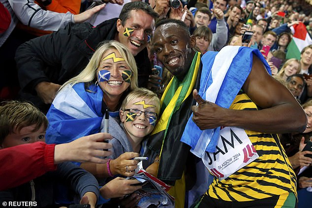 Usain Bolt poses with excited fans at Hampden Park during the Commonwealth Games