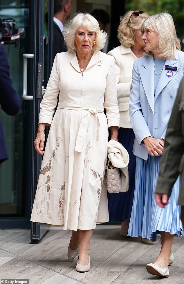 The Queen wore a cream Anna Valentine shirt dress with pale embroidery to Wimbledon.