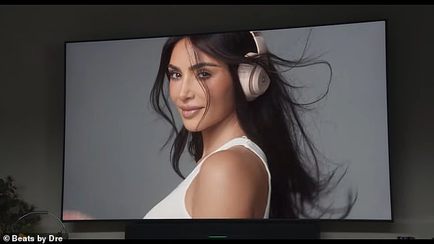 In the ad, she poses up a storm as a wind machine blows her hair around and then ends with her holding a pair of cream-colored shoes and a chocolate brown pair in her hands.