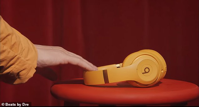 Jimmy's headphones were a mustard yellow shade.