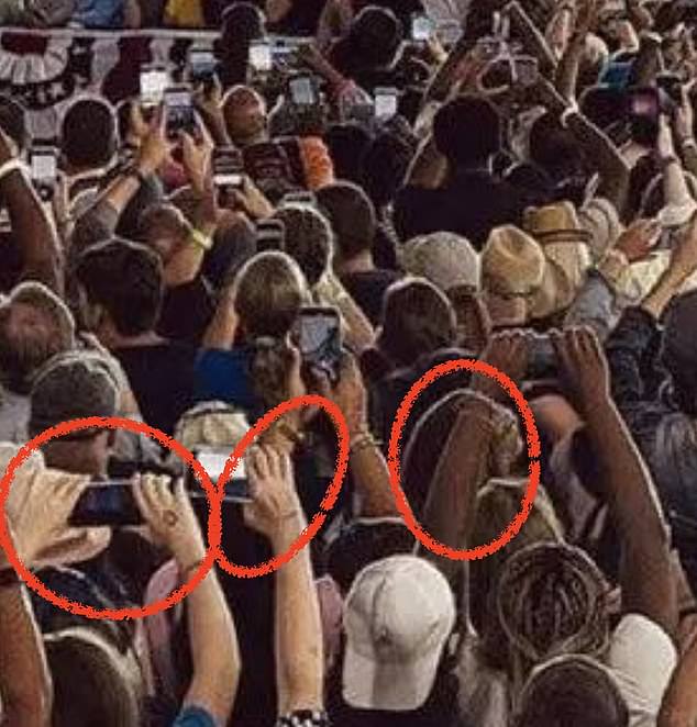 Some social media users pointed out the hands and fingers of people in the crowd, which they said appeared distorted in the image.