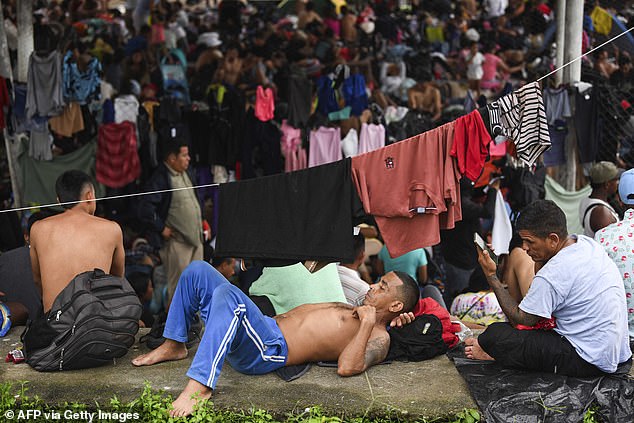 Migrants, mostly from Central America and Venezuela, rest on their way to the United States to escape poverty and violence on the outskirts of Huixtla, Chiapas state, Mexico.