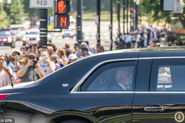 President Joe Biden in the presidential limousine The Beast