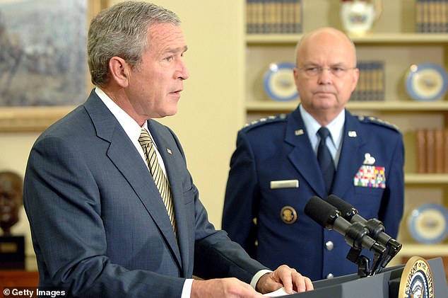 President George W. Bush speaks as former National Security Agency Director Gen. Michael Hayden looks on during a personnel announcement May 8, 2006, in the Oval Office of the White House in Washington, D.C. Both men were instrumental in leading America's war on terrorism following the Sept. 11 attacks.