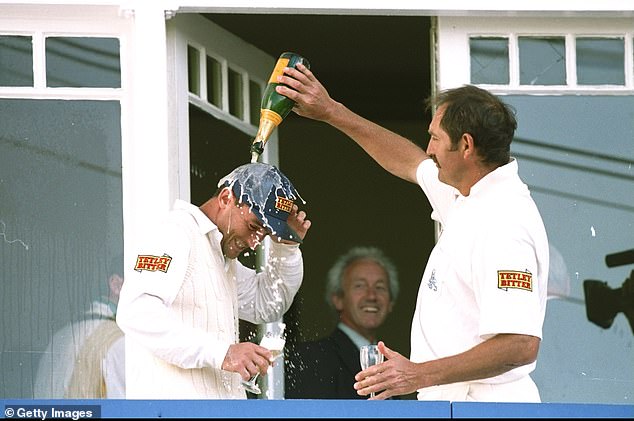 Graham Gooch showers Graham Thorpe with champagne after his century on debut against Australia