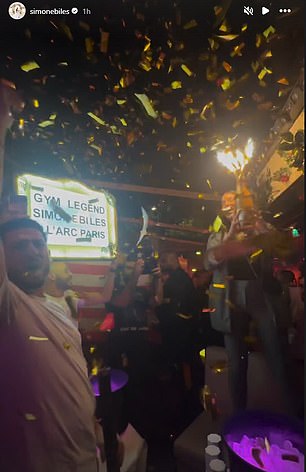 Biles' table at the nightclub was filled with champagne and sparkles.