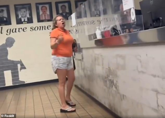 The woman was filmed yelling at officers and suggesting they should shoot homeless people.