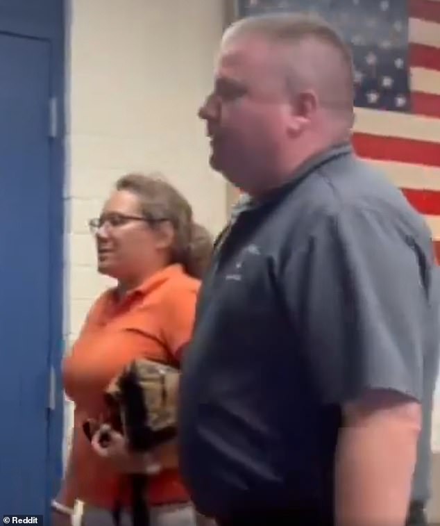 She was escorted out of the station by police and was not charged with any crime.