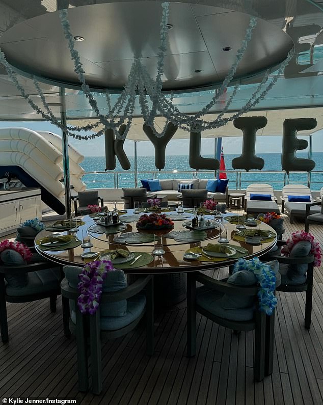 A photo from the deck of his yacht showed a table set for his guests.