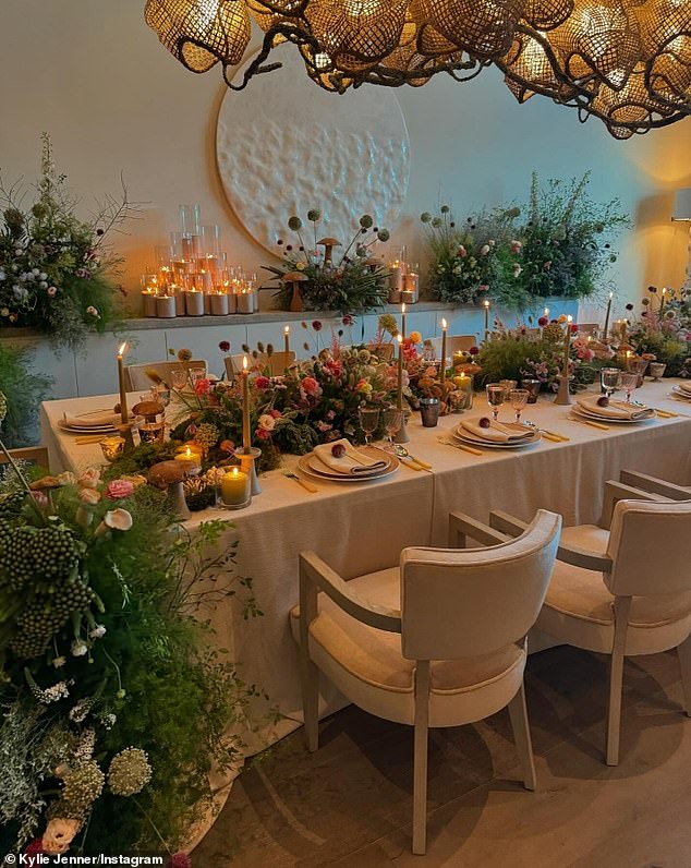 Other images included a more formal dining table covered with flowers and candles and surrounded by more arrangements.