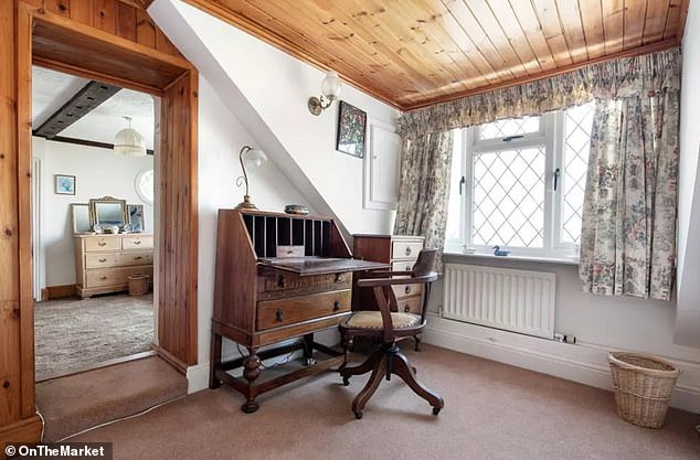 The current study area consists of a lovely desk with chair and writing table at the top of the stairs overlooking the sea.