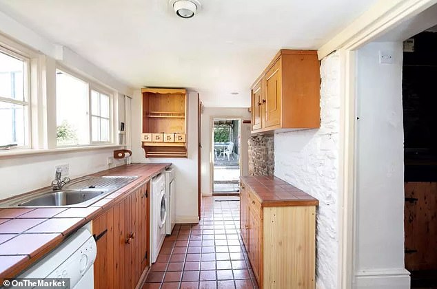 The house's laundry room leads to a small patio and lawn.