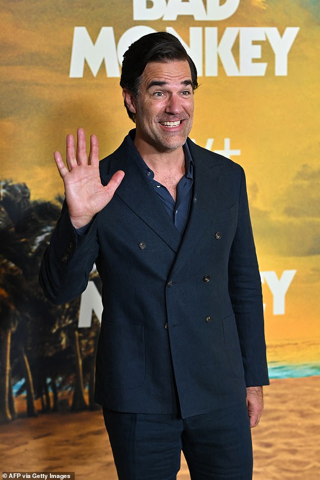 Rob Delaney dressed to impress on the night out in a navy double-breasted blazer and trousers as he posed for photos.