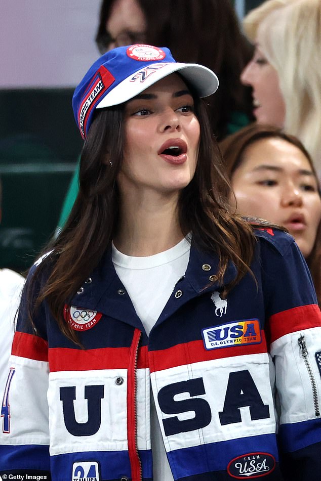 Kendall Jenner opted for a motorsports-inspired jacket by Ralph Lauren and matching cap at the games.