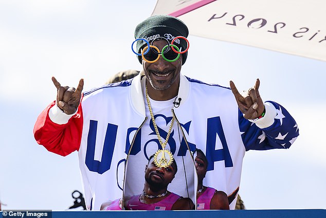 Snoop Dogg, whose real name is Calvin Cordozar Broadus, sported sunglasses in the shape of the Olympic rings.