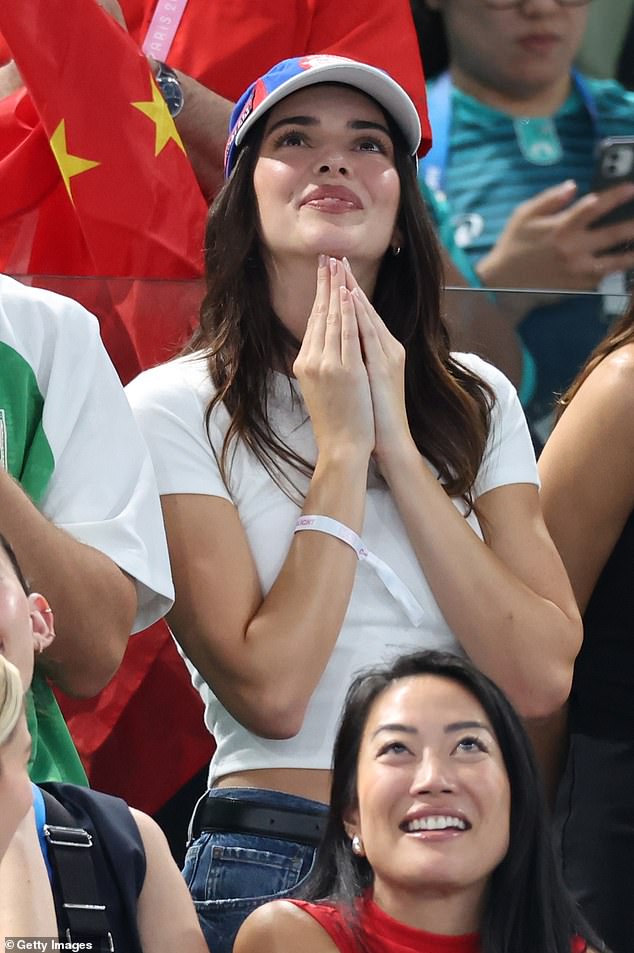 Kendall donned a classic white cropped T-shirt and a pair of blue jeans for the finals of the women's all-around artistic gymnastics competition.