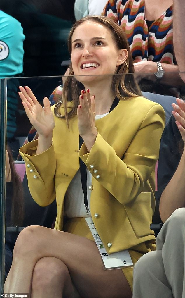 Star Wars actress Natalie Portman looked chic in a mustard blazer and matching skirt.