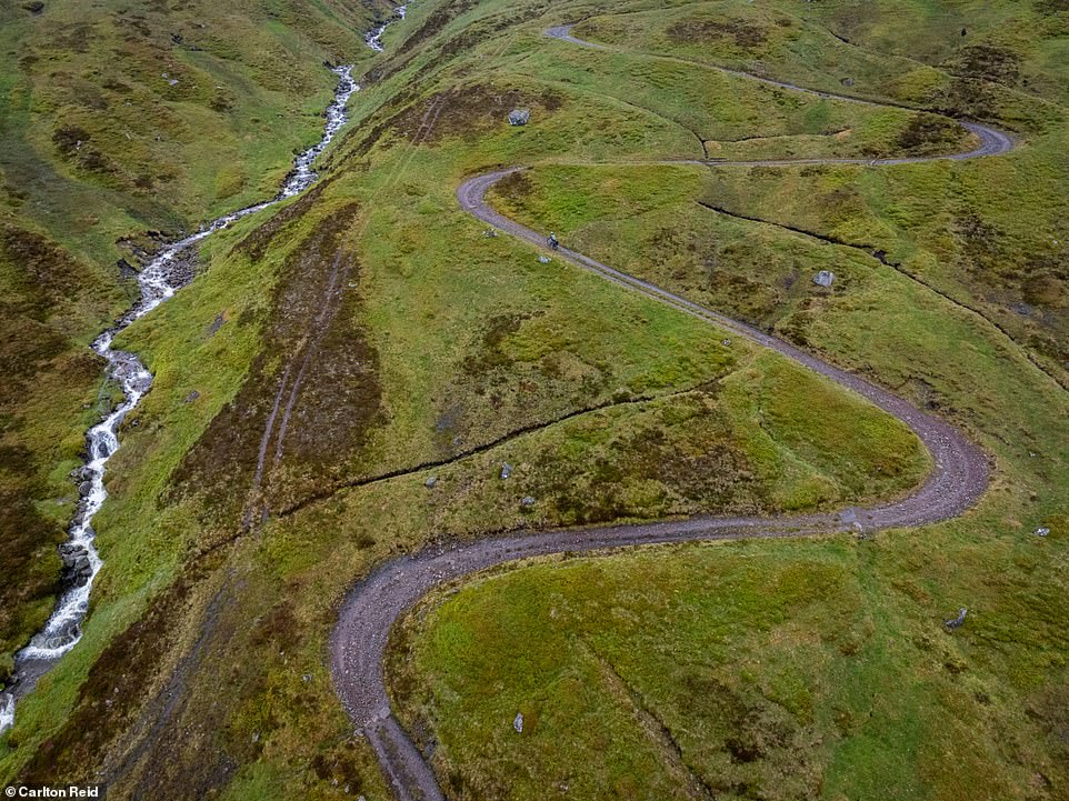 The photo above shows Carlton descending Corrieyairack Pass, with Loch Ness in the background. The image above shows him tackling the gravel hairpin bends of the pass.