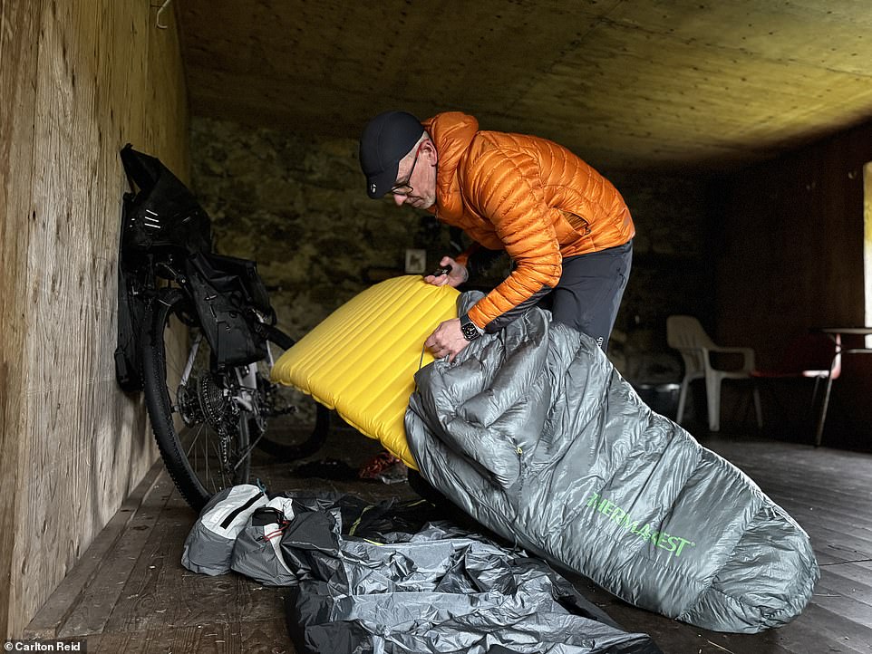 Carlton sets up his Outdoor Research sleeping bag and Thermarest pad and duvet at Blackburn Hut