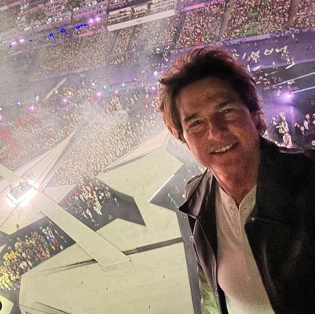 The star shared a selfie from the top of the stadium before performing the death-defying stunt.