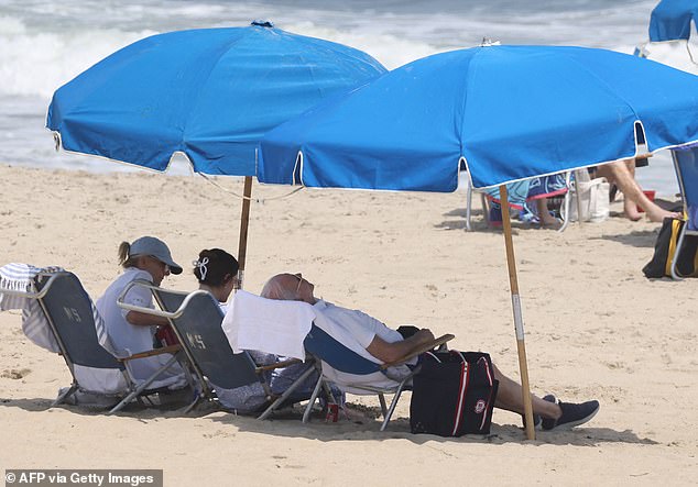 Biden leaned back in his chair on Saturday as he sat with his wife Jill Biden and granddaughter Naomi