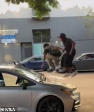 Moments later, the brazen youths threw water on his car.