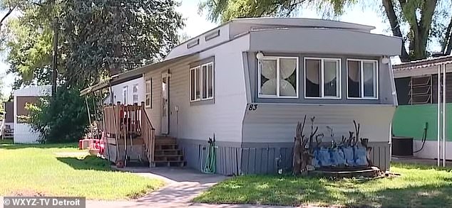 The toddler was confined to a barricaded pen where he slept on a three-foot-by-11-inch wooden board in the mobile home in Madison Heights, Michigan.