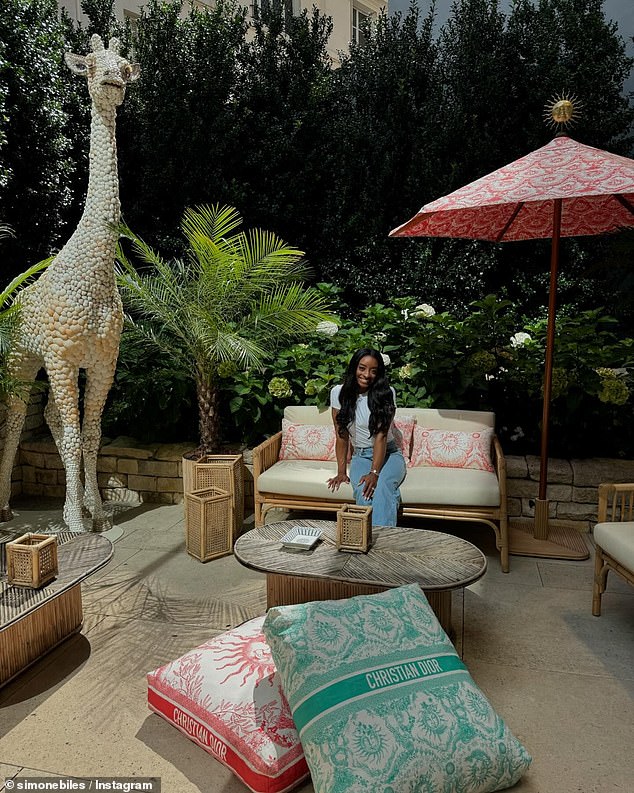 The Team USA superstar posed at the Dior Café, adorned with monogrammed pillows.