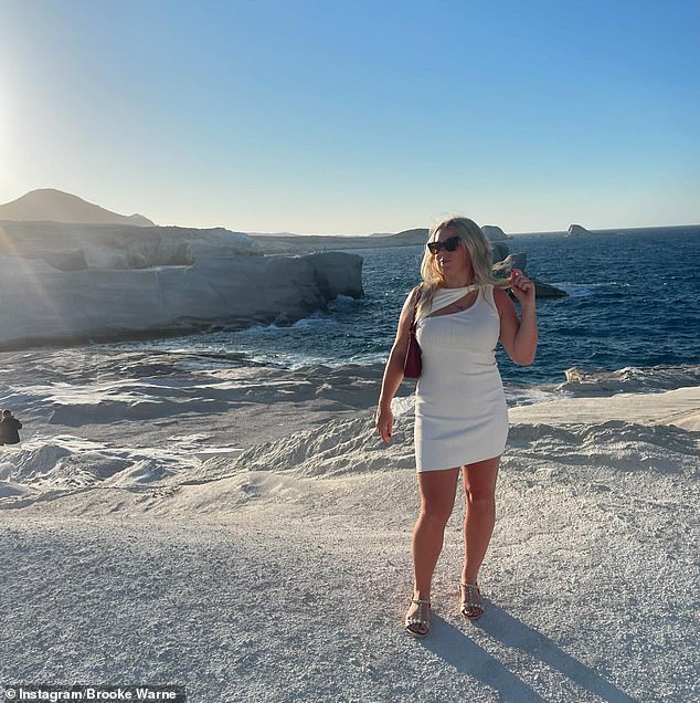 The blonde beauty worked her angles on the stunning beach.