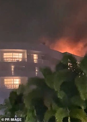 Fire breaks out on roof of Cairns hotel after Blake Wilson crashes helicopter into roof