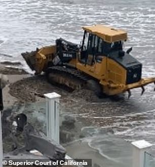 He claims the excavators have polluted the environment and blocked access to the beach.