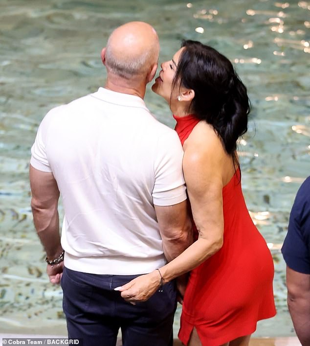 The couple looked very much in love as they showed off their affection amongst the crowd at the Trevi Fountain.