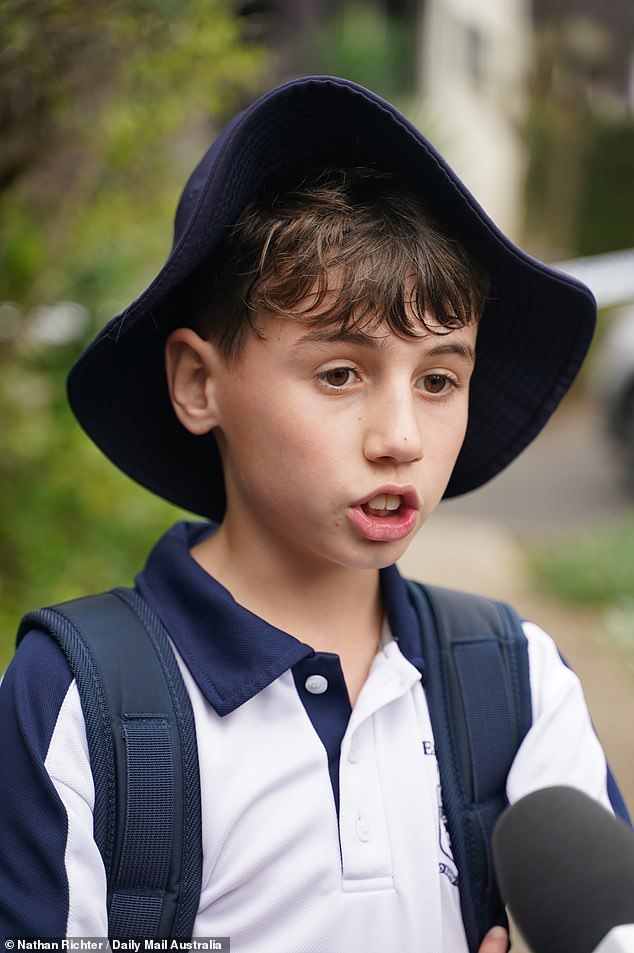 Oliver Hayes (pictured), a classmate of Sophie's 11, left flowers outside her home on Wednesday afternoon with his mother and other school friends. 