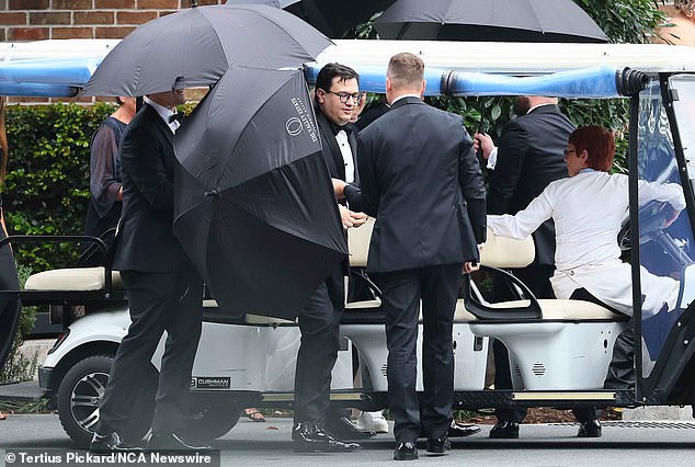 David Sharaz is pictured at his Gold Coast wedding in June, draped in parasols.