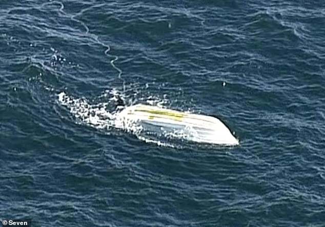 The experienced fishermen's boat (pictured) was found capsized with the men's bodies off the coast of Cassini, Kangaroo Island, South Australia. Police also recovered two life jackets the men were not wearing.