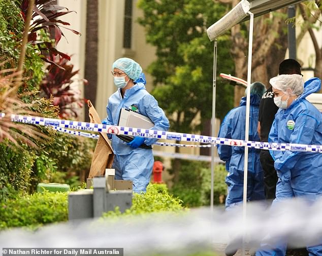 Police tape remains blocking off the residential street and a large forensic criminal van sits outside the front gate of the property, as a team of officers could be seen entering and leaving the suburban home on Thursday morning (pictured)