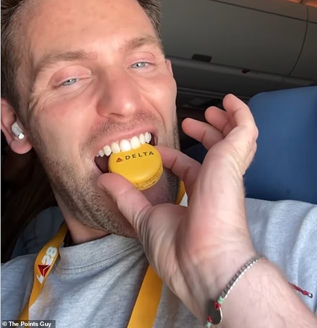 Nicky enjoyed 'fun touches' like a bright yellow Delta-branded macaron during her flight.