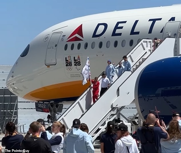 The flag is lowered on the Delta A350 at LAX in preparation for the 2028 Los Angeles Games