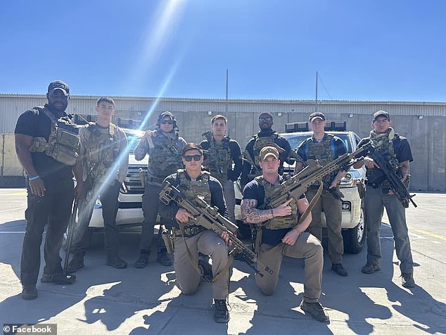 Jacob Ashton (pictured, front right, kneeling) is seen with his colleagues.