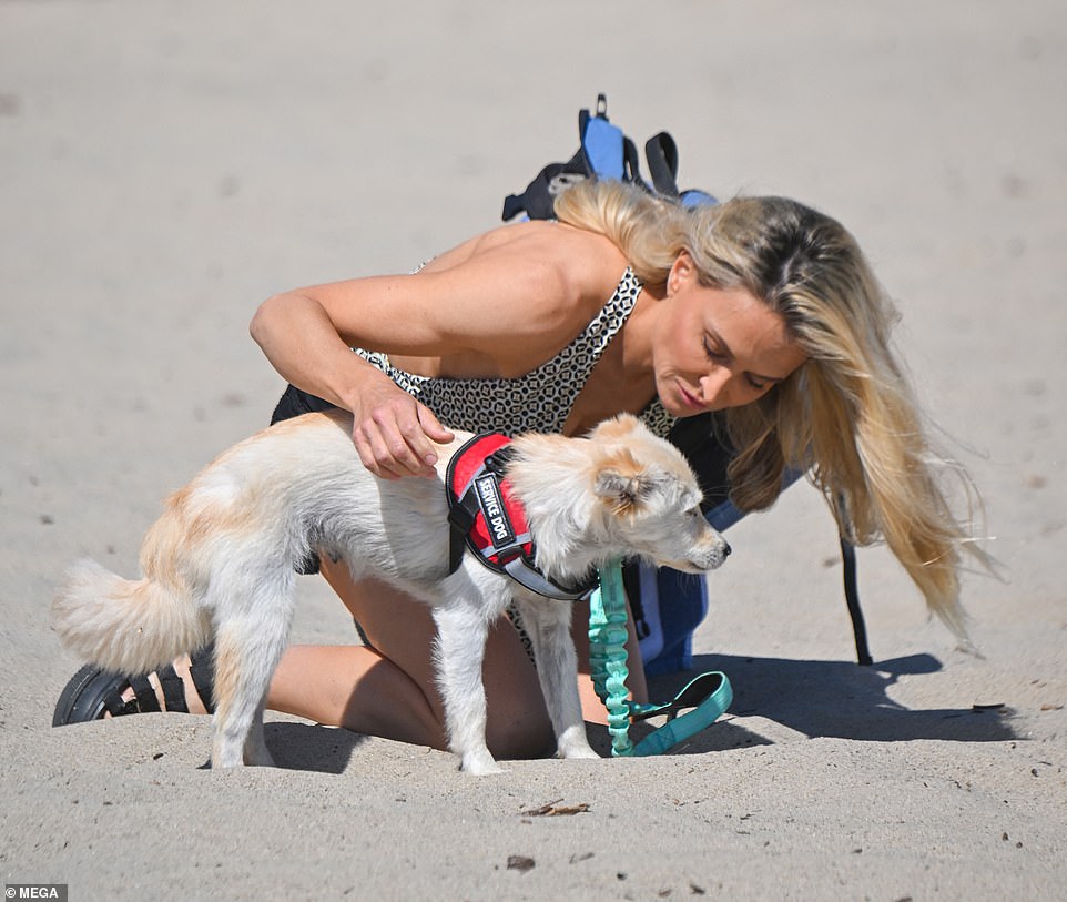 The star doted on her rescue dog named Kayla, who was wearing a service dog harness.