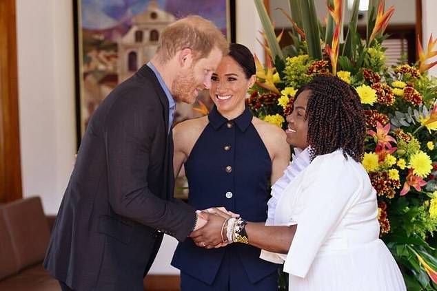 Prince Harry shakes hands with the Vice President as the Sussexes begin their four-day trip to Colombia, arriving in the country's capital today.