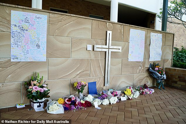 Pictured: A vigil at Emmanuel College held ahead of Friday morning church service in the school chapel.