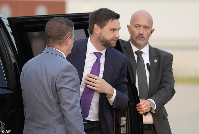 Republican vice presidential candidate Sen. JD Vance, R-Ohio, is escorted by Secret Service agents before his Aug. 7 event in Detroit.