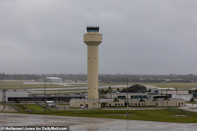 Atha was approached by federal agents when he landed at Palm Beach International Airport.