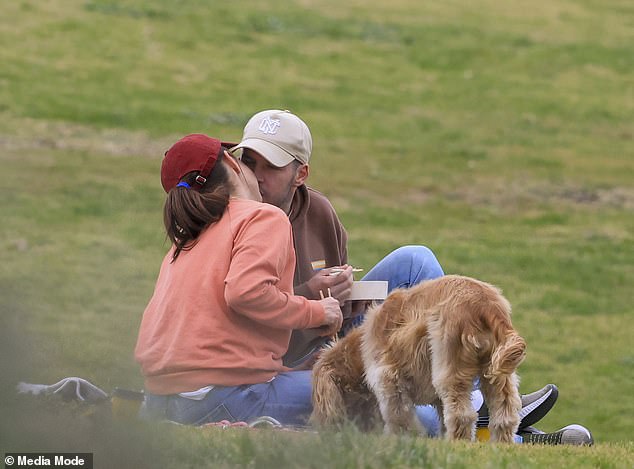 The actress and her new beau looked absolutely loved up last month as they enjoyed a picnic on the seafront in Clovelly, Sydney. The pair couldn't keep their hands off each other, kissing and hugging each other as they sat on a picnic blanket.