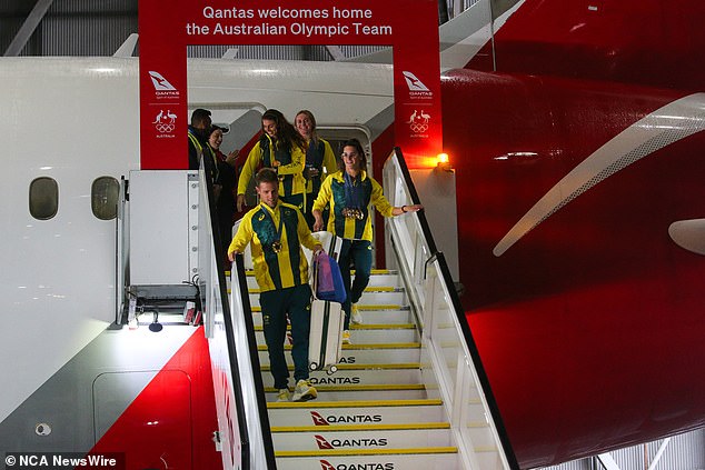 Tired Australians slept most of the way through their Qantas flight home from the Paris Olympics.