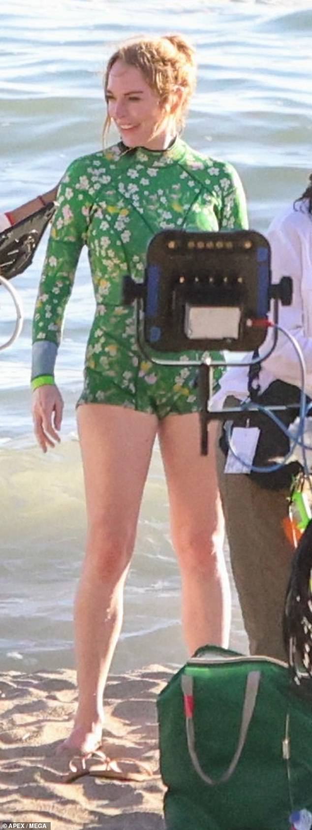 Lohan was later seen standing with her toes in the sand in the middle of the set as they took a break from filming the scene for the highly-anticipated sequel to the 2003 cult classic.