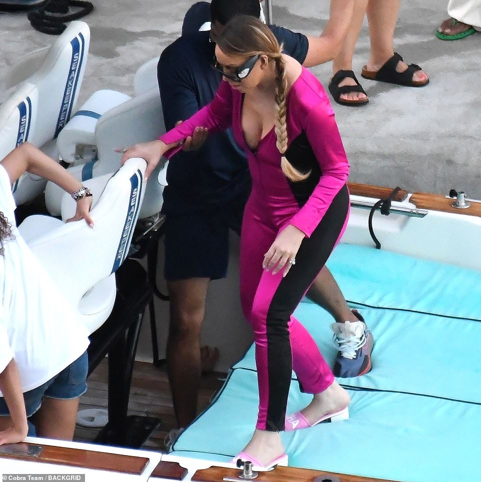 Mariah donned a pair of pink and white open-toed heels as she spent quality time with her twins in Italy.