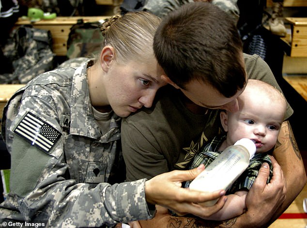 A member of the 82nd Airborne Division feeds her five-month-old son at Fort Bragg, North Carolina, where poverty, hardship and food insecurity are rife.